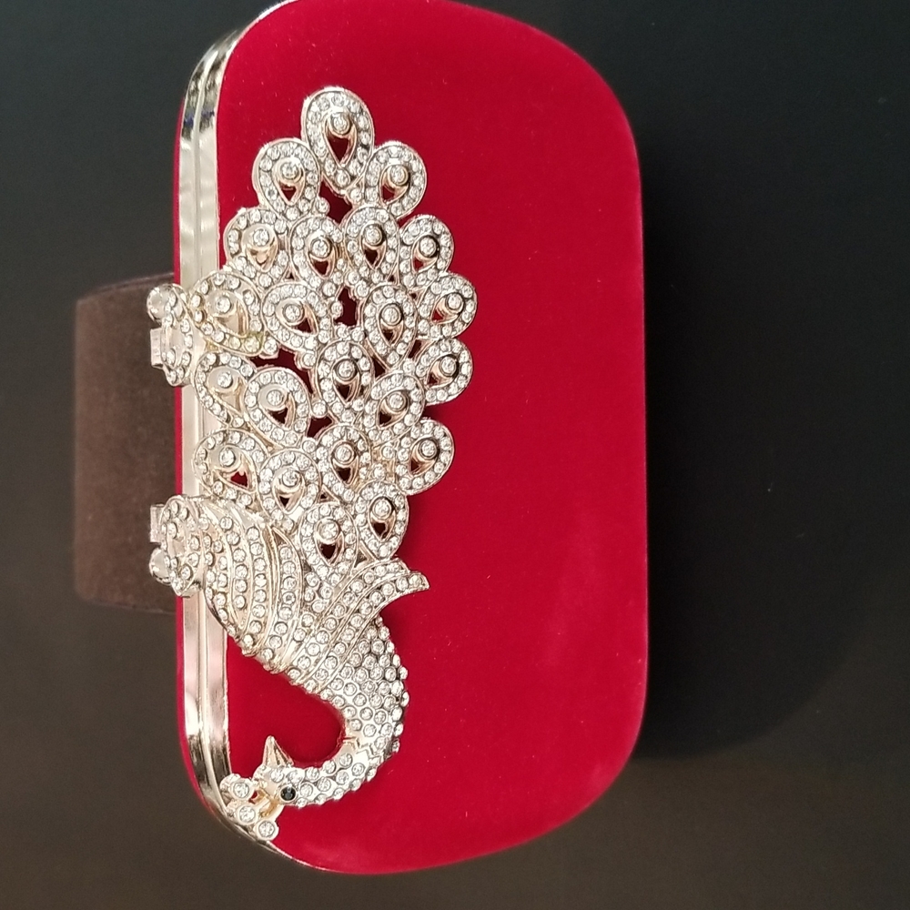 Red velvet evening bag with gold metal peacock crystals. Comes with a gold strap